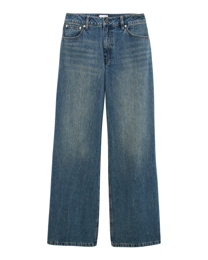Jean pour femme en denim 100% coton, couleur indigo délavée, coupe large et droite offrant un style décontracté et confortable adaptable à toutes les morphologies.