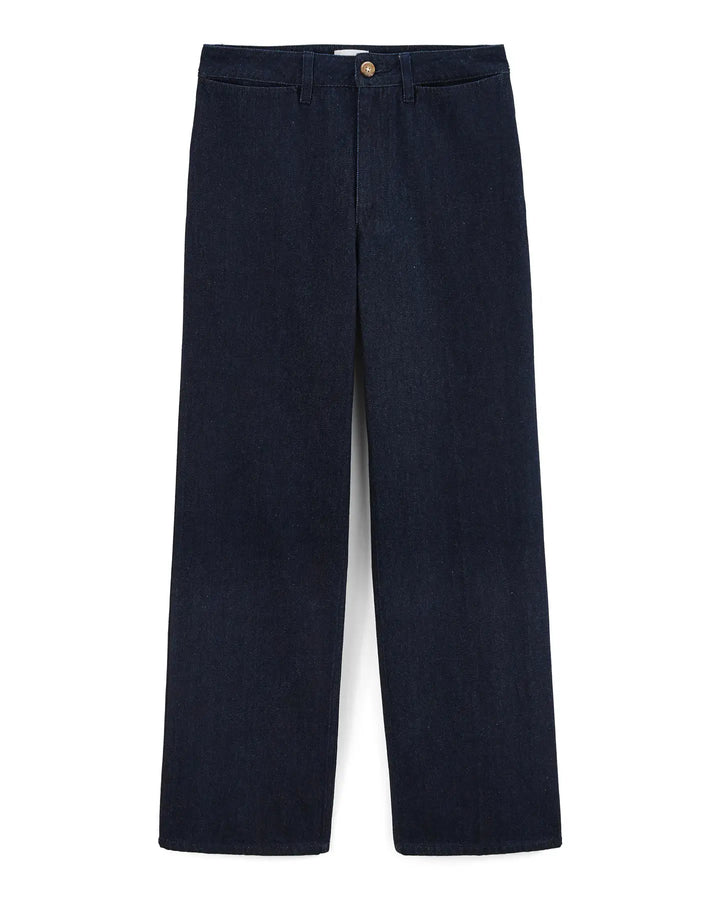 Jean femme en denim brut 100 % coton, coupe large et droite, couleur indigo foncé, matière rigide et structurée, idéal pour toutes les morphologies.