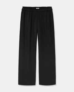 Pantalon noir en tissu fluide Tencel, coupe large et droite, taille élastiquée pour un confort adapté à toutes les morphologies féminines.