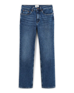 Jean droit en denim 100 % coton de couleur bleu moyen avec coupe ajustée et taille classique, conçu pour s’adapter à toutes les morphologies féminines.